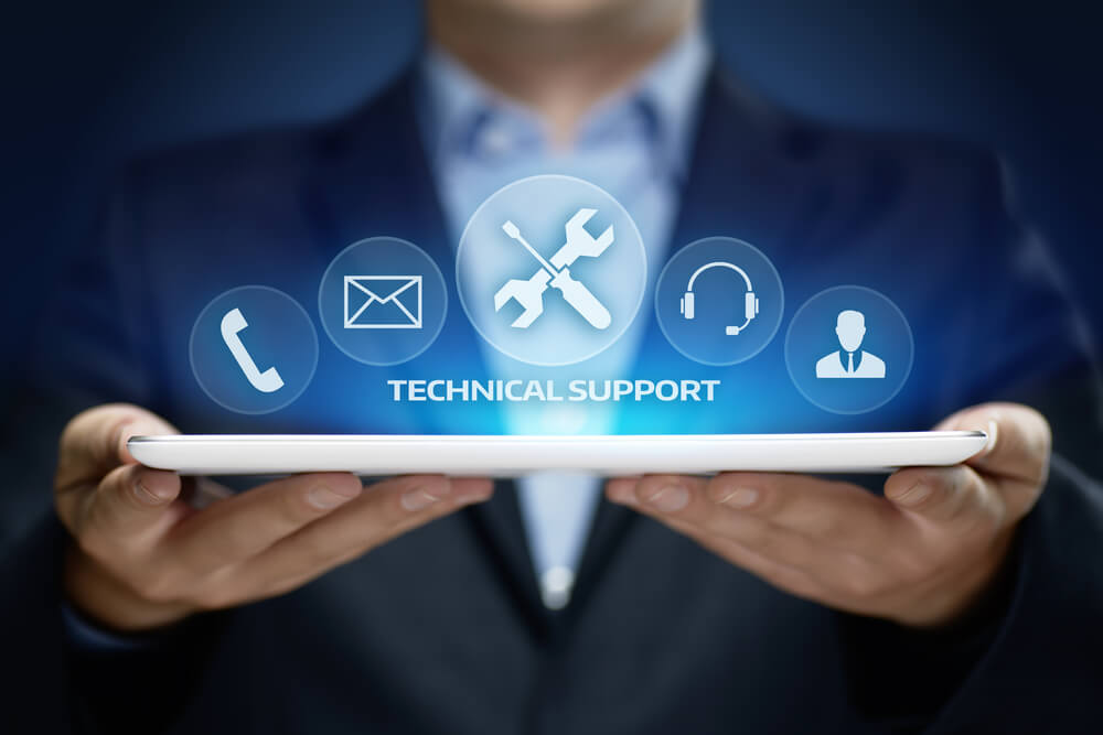 an it professional holding a laptop